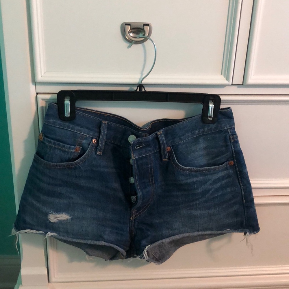 Levi’s dark wash jean shorts with rips